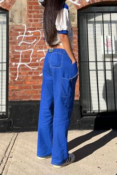 Developing 'the pants' of our dreams entailed a past and present influence. Past, based on one's pre-teen tom boy phase. Present, inspired by a 1930's utility pants found on one's trip to Italy last summer. Our Painter Pants combines the perfect combination of baggy and tailored fit. Fitted Denim Blue Bottoms With Contrast Stitching, Blue Full Length Sweatpants With Pockets, Spring Bottoms With Contrast Stitching Full Length, Blue Wide Leg Bottoms With Contrast Stitching, Blue Wide-leg Bottoms With Contrast Stitching, Blue Pants With Contrast Stitching For Spring, Spring Blue Pants With Contrast Stitching, Baggy Wide-leg Pants With Contrast Stitching, Blue Full-length Parachute Pants