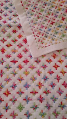 a white sheet with colorful stars on it