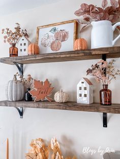 the shelves are decorated with fall decorations and pumpkins