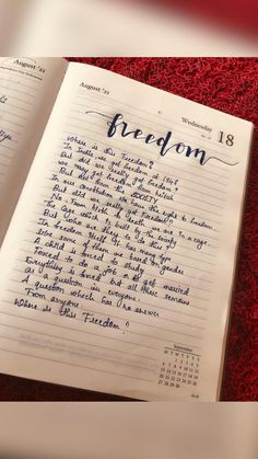 an open notebook with writing on it and the word'freedom'written in cursive ink