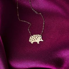 This cute 14k solid gold hedgehog necklace is the best gift for all those who love nature and wildlife we find in! Animal lovers will be admire with this cute little porcupine pendant. DIALOOK JEWELRY ITEM DETAILS Material: 14K Solid GOLD (Not Filled or Plated). Gold Necklace Chain Length: 16,7" inch (42,5cm) Main Chain and 1" inch (2,5cm) Adjustable Chain Part Total: 17,7" inch (45cm) Chain Width: 1mm Finish: 14K Yellow Gold Featuring: 10x17mm Hedgehog Pendant Stone: Zircon. Each order will be Gold Necklace With Animal Design For Gift, Gold Animal Design Necklace For Gift, Fawn Necklace, Hedgehog Necklace, Gold Acorn Necklace, Gold Necklace Chain, Hedgehog Gifts, Nature And Wildlife, Solid Gold Necklace