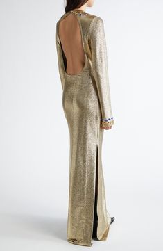 Julien Dossena re-creates the fashion house's signature shine in this gilded gown centered with a circular chest cutout surrounded by dazzling crystal embellishments. 58" length (size 38FR) Back cutout with button-and-loop closure Jewel neck Long sleeves Side slits Unlined 73% viscose, 20% polyester, 7% elastane with 90% cupro, 10% elastane contrast Dry clean Made in Portugal Designer Clothing Luxury Gold Maxi Evening Dress, Luxury Festive Maxi-length Gown, Luxury Gold Evening Dress, Luxury Festive Evening Dress For Prom, Luxury Embellished Maxi-length Gown, Luxury Backless Evening Dress, Luxury Gold Maxi Dress For Evening, Luxury Evening Dress With Back Opening For Gala, Luxury Festive Evening Dress