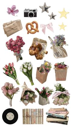 a bunch of flowers that are sitting on top of a table next to some books