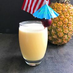 a pineapple drink next to an american flag