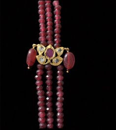 long necklace made using glass Ruby beads cz polki stones gold plated length 12 inch on each side Ruby Beads, Silver Jewelry Earrings, Silver Jewelry Pendant, Jewelry Design Necklace, Stone Gold, Beads Necklace, Pendant Set, Long Necklace, Jewelry Stores