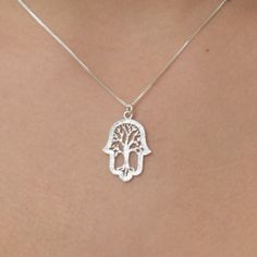 New! New! Beautiful silver Tree of life Hamsa necklace set on a dainty and feminine silver chain.. ~~Necklace measurements on model is 16inch~~ size 1.5X2cm 0.59X0.78inch This necklace will be Packed perfectly in a gift box with an organza bag. Also ready for giving as a gift. View more dainty Necklaces ~ https://www.etsy.com/il-en/shop/DoronJewelry?section_id=16043125&ref=shopsection_leftnav_1 https://www.etsy.com/il-en/shop/DoronJewelry?ref=shopsection_shophome_leftnav GIFT IT I can ship t Sterling Silver Tree Of Life Jewelry, Spiritual Tree Of Life Sterling Silver Necklace, Spiritual Sterling Silver Jewelry With Tree Of Life, Symbolic Silver Necklace With Tree Of Life, Silver Tree Of Life Necklace For Jewelry Making, Symbolic Sterling Silver Tree Of Life Jewelry, Symbolic Tree Of Life Sterling Silver Jewelry, Necklace Measurements, Necklace Tree