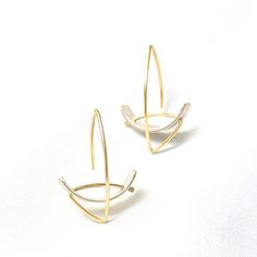 Gold & Silver Earrings - Intersecting arcs and lines create this sophisticated and simple design. The matte or oxidized sterling silver arc is contrasted by a high-polish argentium silver or 18k gold ear wire. Rubber backs provided. Modern Brass Wrap Earrings, Side Crow Pose, Side Crow, Line Earrings, Crow Pose, Dynamic Lines, Artful Home, Argentium Silver, Lovely Earrings