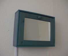 a mirror mounted to the side of a wall