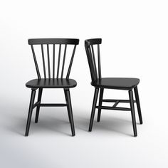 two black chairs side by side on a white background