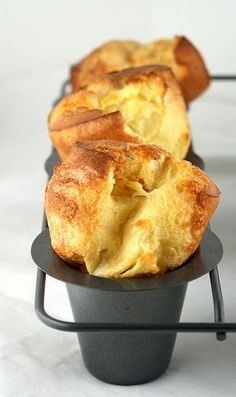 some food that is sitting on top of a black plate and cooling rack with it's crusts