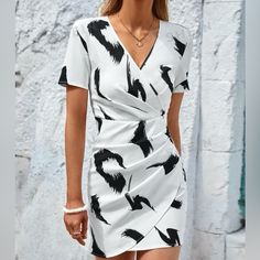 Black And White Casual Mini Dress. 100% Polyester - Non-Stretch Questions? Comment Below Chic Black And White V-neck Dress, Black And White Summer Workwear Dress, Black And White Summer Work Dress, Chic Black And White Short Sleeve Dress, Black And White Dress For Summer Workwear, Black And White Short Sleeve Summer Dress, Black And White Short Sleeve Spring Dress, Black And White Short Sleeve Dress For Spring, Black And White Casual Dress