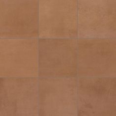 a brown tile wall with four squares in the middle and one square at the top