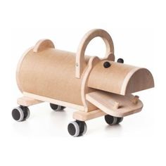 a wooden toy with wheels and a dog on it