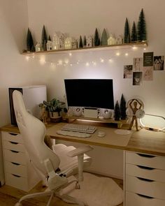 a white chair sitting in front of a computer desk