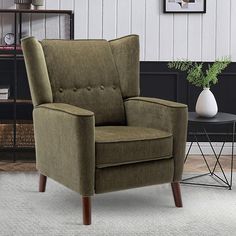 a living room with a brown chair and white rug