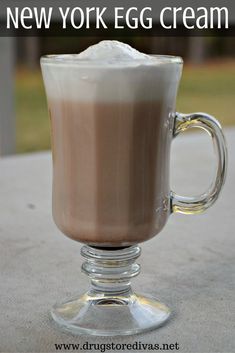 an egg cream coffee drink in a glass mug