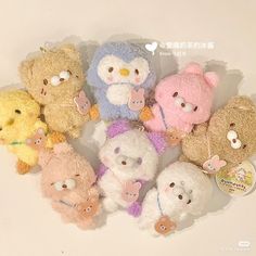 a group of stuffed animals sitting next to each other