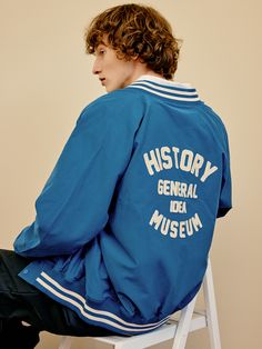 Editor's notesIt is a casual stadium jacket in polyester blend cotton fabric. The jacket features soft touch and semi-glossy texture. It has lettering graphic on the back and stripes on neck, cuffs, and hem. The colorblock point in classic mood and matte spring snap button add vintage and classic vibe.- Standard fit- Ribbed neck, cuffs, hem- Side pockets- Snap button closureMeasurements(in.)M / L- Center back to sleeve hem: 32.3 in. / 35.4 in.- Chest: 22.4 in. / 24.4 in.- Hem: 13.8 in. / 16.5 in Collegiate Cotton Outerwear With Letter Patch, Cotton College Style Varsity Jacket For Campus, College Style Cotton Varsity Jacket For Campus, College Cotton Varsity Jacket With Letter Patch, Cotton Varsity Jacket With Letter Patch, Cotton Varsity Outerwear With Baseball Collar, Cotton Windbreaker With Letter Print For Streetwear, Cotton Letter Print Windbreaker For Streetwear, Sporty Letter Print Outerwear For Campus