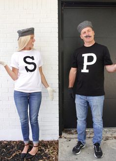 a man and woman dressed up in t - shirts with the letter p on them