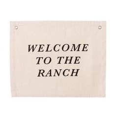 a welcome to the ranch sign hanging on a wall in front of a white background