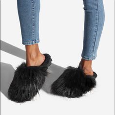 A Cozy Slip-On Fuzzie With A Faux-Fur Lining. Material: Textile Features: Memory Foam Padding For Added Comfort Outside Heel Height: 0.5" Imported Black Faux Fur Slippers For Winter, Winter Faux Fur Flat Slippers, Comfortable Black Slippers With Faux Fur Lining, Black Fluffy Slippers For Winter, Casual Soft Faux Fur Slippers, Casual Faux Fur Lined Slippers, Casual Faux Fur Slippers, Black Cozy Slippers With Round Toe, Black Casual Slippers With Faux Fur Lining