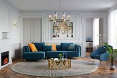 a living room filled with furniture and a fire place under a chandelier in front of a fireplace