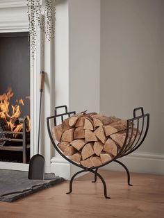 a fire place with logs in front of it