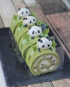 there is a cake made to look like panda's on top of each other