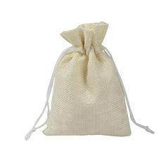 a white bag filled with lots of small bags on top of a white tablecloth