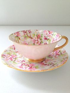 a cup and saucer sitting on top of each other