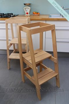 two wooden step stools in a kitchen