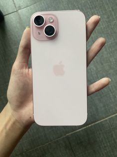 someone holding an iphone in their hand with the camera on it's left side