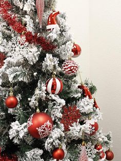 a decorated christmas tree with red and white ornaments