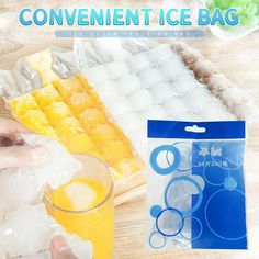 a person is holding a plastic bag next to an ice bag and a glass filled with orange juice