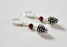 "Handcrafted sterling silver pine cone earrings are a perfect nature or woodland jewelry for women! Unique Mother in Law, daughter or Mothers Day gift! Freshwater pearls are wire wrapped to each pine cone charm and sterling silver lever back ear wire. The pearls have a nice brownish luster. The length of the earring from the ear wire is 1\". Check out the matching necklace! https://www.etsy.com/listing/503708321/pine-conenecklacependant40th-birthday These pine cone earrings are perfect for the n Christmas Anniversary Jewelry With Matching Earrings, Matching Earrings Jewelry For Christmas Anniversary, Famous Geminis, Pine Cone Earrings, Pine Cone Wedding, Wedding Woodland, Christmas Jewellery, Woodland Jewelry, Unique Birthday Gift