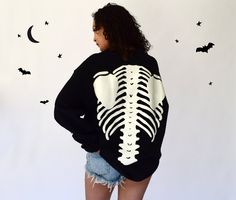 Stock is very limited this year, so get it before it's gone. Very high quality, super cool, oversized sweatshirt with 3D puff printed skeleton design on the arms, front, and back. Glow in the dark effect is very strong. You just need to expose it to sunlight for a few minutes.  Both the female and the male models are 5'8 and are wearing size Large. Exchanges are accepted on this item in case you would like a different size. 100% cotton. Oversized Sweatshirt For Halloween Streetwear, Oversized Long Sleeve Sweatshirt With Skull Print, Oversized Long-sleeve Sweatshirt With Skull Print, Oversized White Halloween Sweater, Halloween Streetwear Sweatshirt With Relaxed Fit, Oversized Halloween Sweatshirt For Loungewear, Oversized Spooky Halloween Sweatshirt, Spooky Oversized Halloween Sweatshirt, Dark Effect