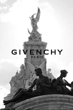 a black and white photo with the words givenchy on it in front of a statue