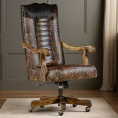 an office chair made out of wood and leather with wheels on the back, in front of a door