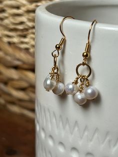 Modern and classic earrings 14k gold fill ear wire with bundle of three delicate white freshwater pearls  14k gold fill ear wire Handmade in Washington, USA Gift 14k Gold Filled Pearl Earrings With Ear Wire, Dainty Gold Wire Wrapped Pearl Earrings, Wire Wrapped 14k Gold Filled Dangle Pearl Earrings, 14k Gold Filled Wire Wrapped Dangle Pearl Earrings, Dainty Wire Wrapped Pearl Earrings In 14k Gold, Dainty Wire Wrapped Dangle Pearl Earrings, Dainty Wire Wrapped 14k Gold Filled Pearl Earrings, Everyday Gold Wire Wrapped Pearl Earrings, Nickel-free White Pearl Earrings In 14k Gold