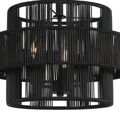 a black chandelier with four lights on it's sides and an intricate design