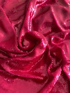 the fabric is shiny and bright pink