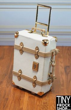 Integrity Luxe Travels Large Rolling Luggage Suitcase This luxurious luggage features a gold accents, tan vinyl trim on a white matte vinyl body with floral lining for a timeless look and feel. This is an incredible piece with amazing detail including a handle that goes up and down and wheels. This bag is built to make a lasting impression. Opens. Luxury White Luggage For Everyday Use, Elegant White Rectangular Luggage, Luxury White Rectangular Luggage, Luxury White Bags With Brass Hardware, White Luxury Bags With Brass Hardware, Elegant White Luggage For Travel, Elegant White Travel Luggage, Gold Rectangular Luggage For Travel, Gold Luggage With Sleeve For Travel