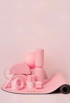 a pink table with various items on it