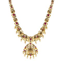 Designed with the elegance traditional Indian jewelry is known for, this 22k antique gold necklace by Virani Jewelers features rubies and cubic zirconia stones.The antique 22k gold finish offers a sophisticated, vintage look, while the gemstones add a vibrant contrast. Ideal for formal events and celebrations, this stunning gold necklace is a beautiful representation of traditional craftsmanship, blending heritage and contemporary style for those who appreciate luxurious, meaningful jewelry.Features• 22k yellow gold• Antique finish• Engraved details• Cubic zirconia• Ruby Specifications:• Minimum Width - 2.3 millimeters• Maximum Width - 50.5 millimeters• Length - 26 inches• Weight - 84 grams Luxury Kundan Jewelry With Gemstones, Luxury Kundan Necklace With Cubic Zirconia, Luxury Red Necklace For Puja, Luxury Gold Necklace With Antique Finish, Luxury Red Necklaces For Puja, Luxury Traditional Antique Gold Jewelry, Traditional Luxury Engraved Necklaces, Luxury Elegant Necklace With Antique Finish, Luxury Antique Gold Necklace