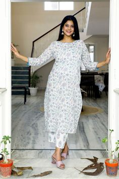 A handpicked style with you in mind, this hand block printed cotton kurta set with floral pattern showcases the classic summer chic look. Style in strait fit pattern, the sequin pattern on the round neck, blue piping along the neckline and sleeve ends and the white and pink threadwork on the sleeves add grace to the entire look. Simple back, white colored pants with floral blockprint and three-quarter sleeves provide the finishing touch to the overall look. Detail: This is 2 Pc. Set Kurta set : Kurta Set For Women, Hand Block Print, Blue Hand, Summer Chic, Colored Pants, Kurta Set, Ethnic Wear, Set For Women, Three Quarter Sleeves