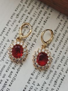 Ruby Red & Crystal Teardrop Teardrop Jewel Huggie Hoop Earrings, 14k Gold Plated Earrings, Vintage Style Earrings, Victorian Earrings  Product specifications: * Material: 14K Gold Plated Brass * Size Each charm measures 1.5 cm x 1.7cm Earring Options: * 8mm inner diameter hoops * 10mm inner diameter hoops * 1.8cm drop hooks Packaging and Gifts: * All pieces of jewellery are set on a card in a mesh jewellery pouch  Shipping: * All Australian orders will be shipped out within 1 - 3 days by standard untracked letter post. If you require tracking, please upgrade to that option at the time of checkout. I cannot be held responsible for missing orders if you do not upgrade. Delivery within 5 - 6 days. INTERNATIONAL BUYERS please note shipping can sometimes take up to 3 weeks. Care instructions: * Victorian Earrings, Jewellery Pouch, Vintage Style Earrings, Red Crystals, Huggie Hoop Earrings, Earrings Vintage, Style Earrings, Gold Plated Earrings, Jewelry Earrings Hoops