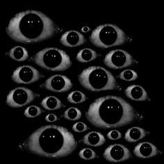 an image of many eyes in the dark