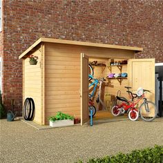 a wooden shed with two bicycles in it