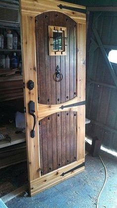 an open wooden door in the corner of a room