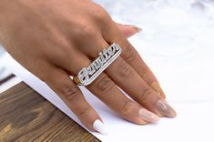 Share your story with our Two Finger Name Ring! Customize with a Name, Date, Roman Numerals, or Words. Metals: Sterling Silver or 14K Gold over Sterling Silver Sizes: 4-12 Customize up to 6 characters Please allow 2-3 weeks for delivery 6 Characters, Share Your Story, Name Ring, Name Rings, Roman Numerals, 3 Weeks, Your Story, Personalized Jewelry, Amazing Women